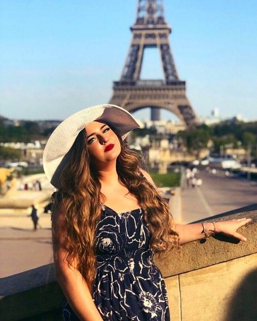 Mikayla Jarratt standing in front of Eiffel Tower